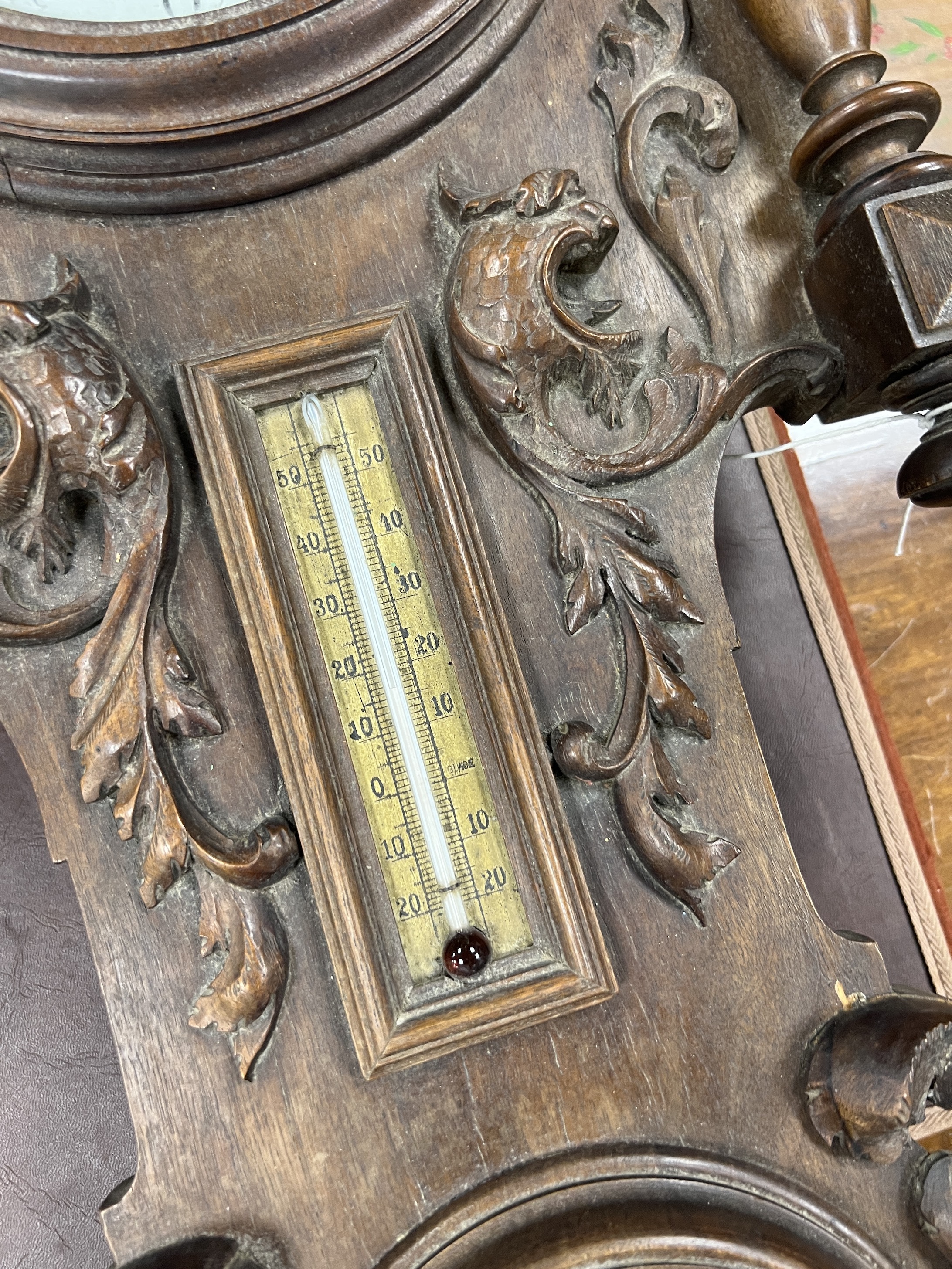 A late 19th century French carved walnut wall clock combined thermometer and barometer, dial and movement marked J Baptiste Baillon, Paris, height 93cm